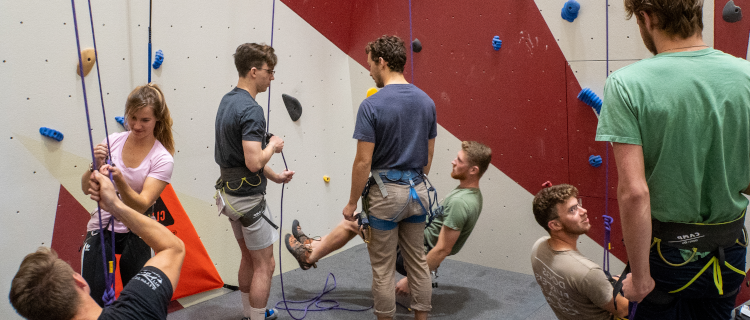 Students try out the rock-climbing equipment